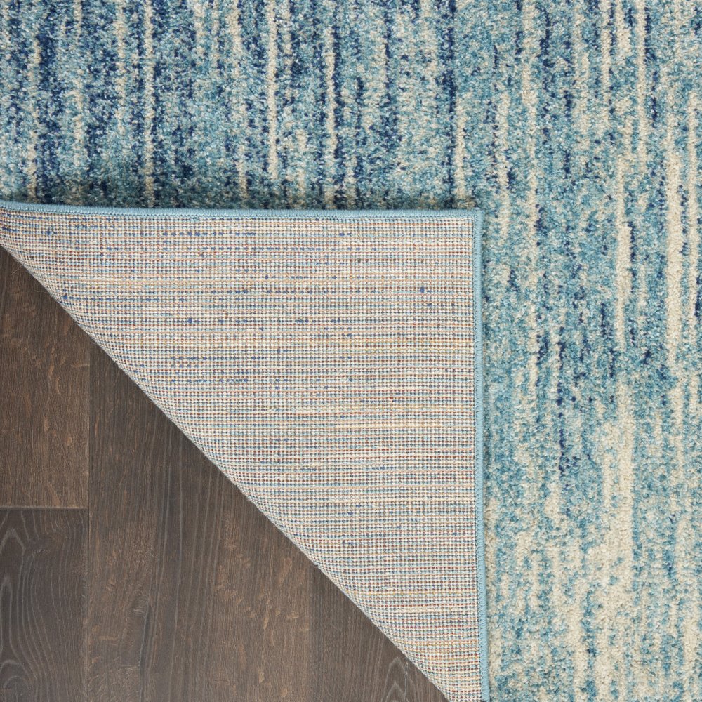 5' X 7' Blue And Ivory Abstract Area Rug