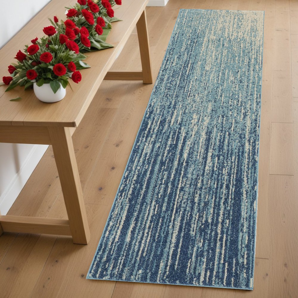 5' X 7' Blue And Ivory Abstract Area Rug