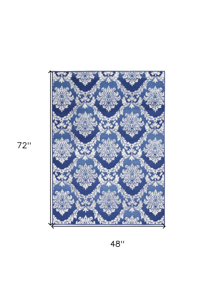 6' X 9' Blue And Ivory Damask Distressed Area Rug