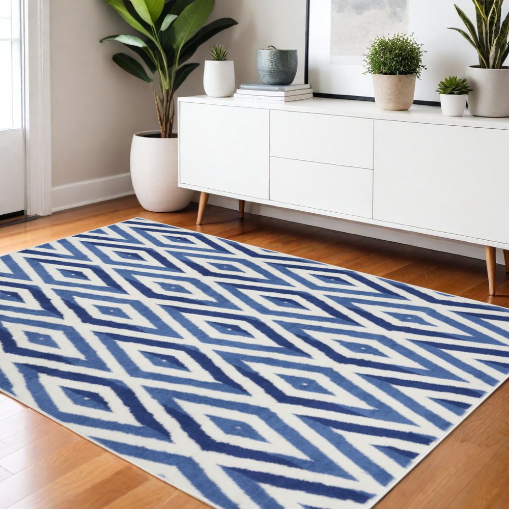 5' X 7' Ivory And Blue Geometric Area Rug
