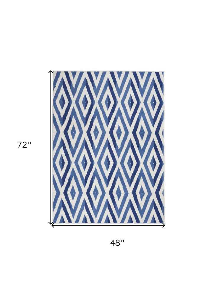 5' X 7' Ivory And Blue Geometric Area Rug