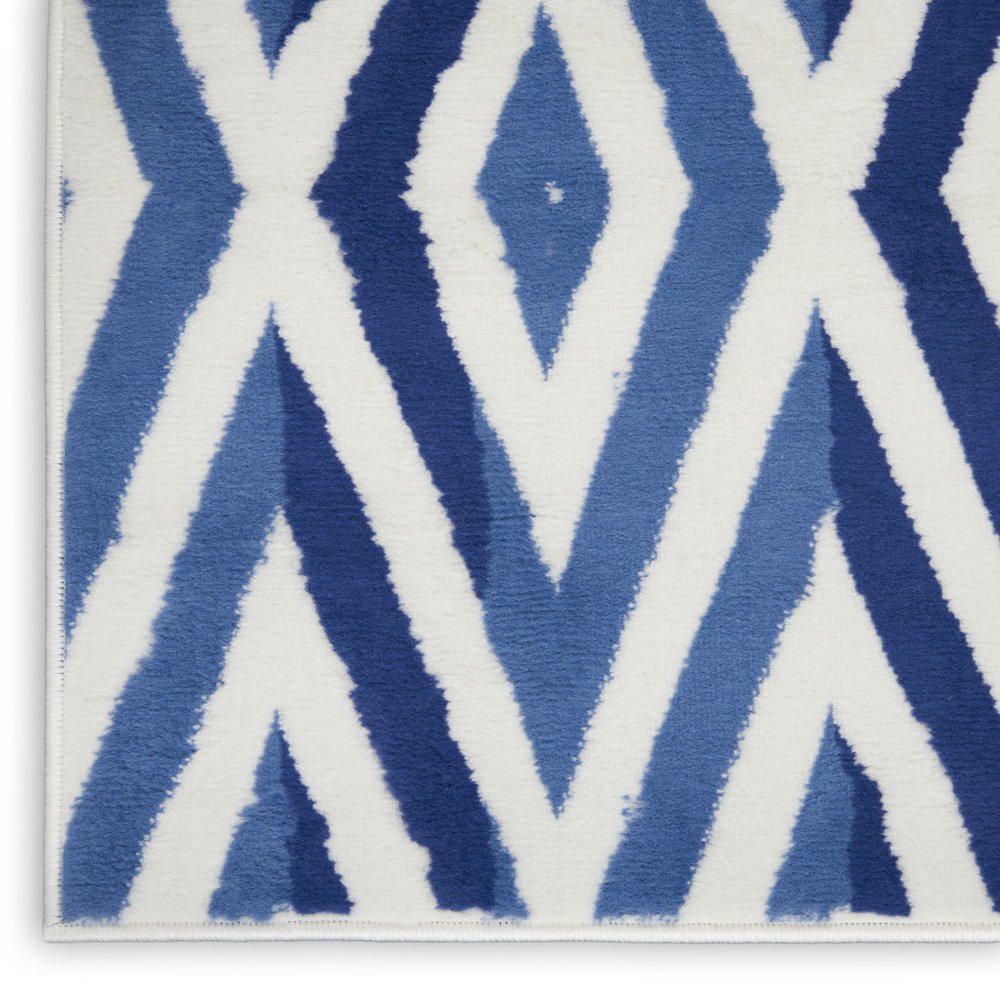 5' X 7' Ivory And Blue Geometric Area Rug