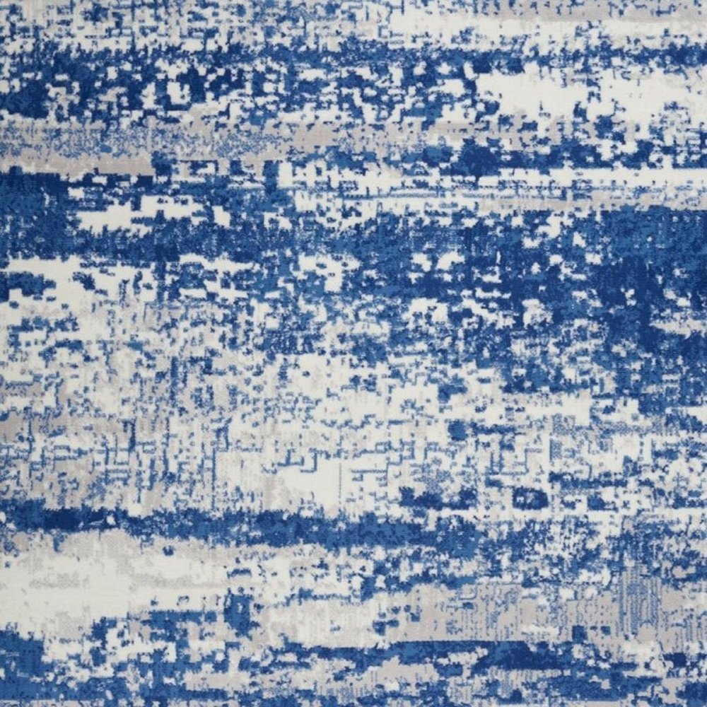 6' X 9' Ivory And Blue Ombre Distressed Area Rug