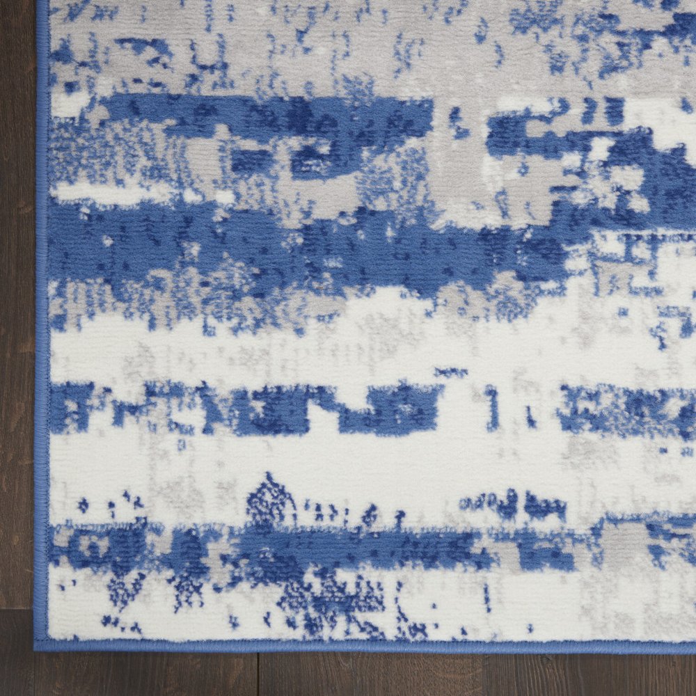 6' X 9' Ivory And Blue Ombre Distressed Area Rug