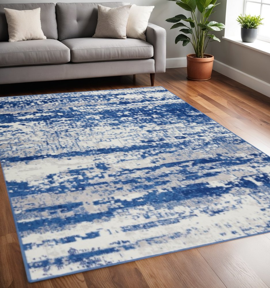 6' X 9' Ivory And Blue Ombre Distressed Area Rug