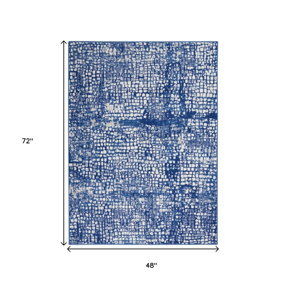 4' X 6' Ivory And Blue Geometric Area Rug