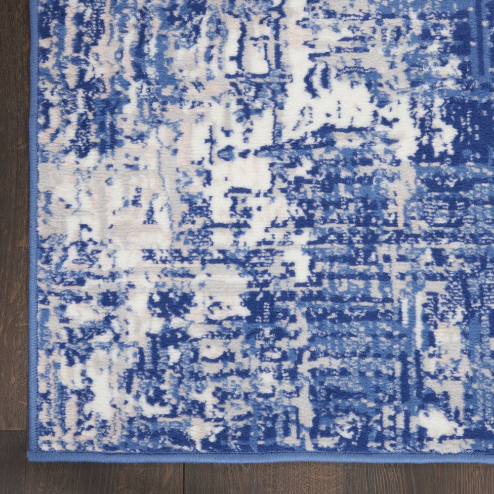 6' X 9' Blue And Ivory Abstract Distressed Area Rug
