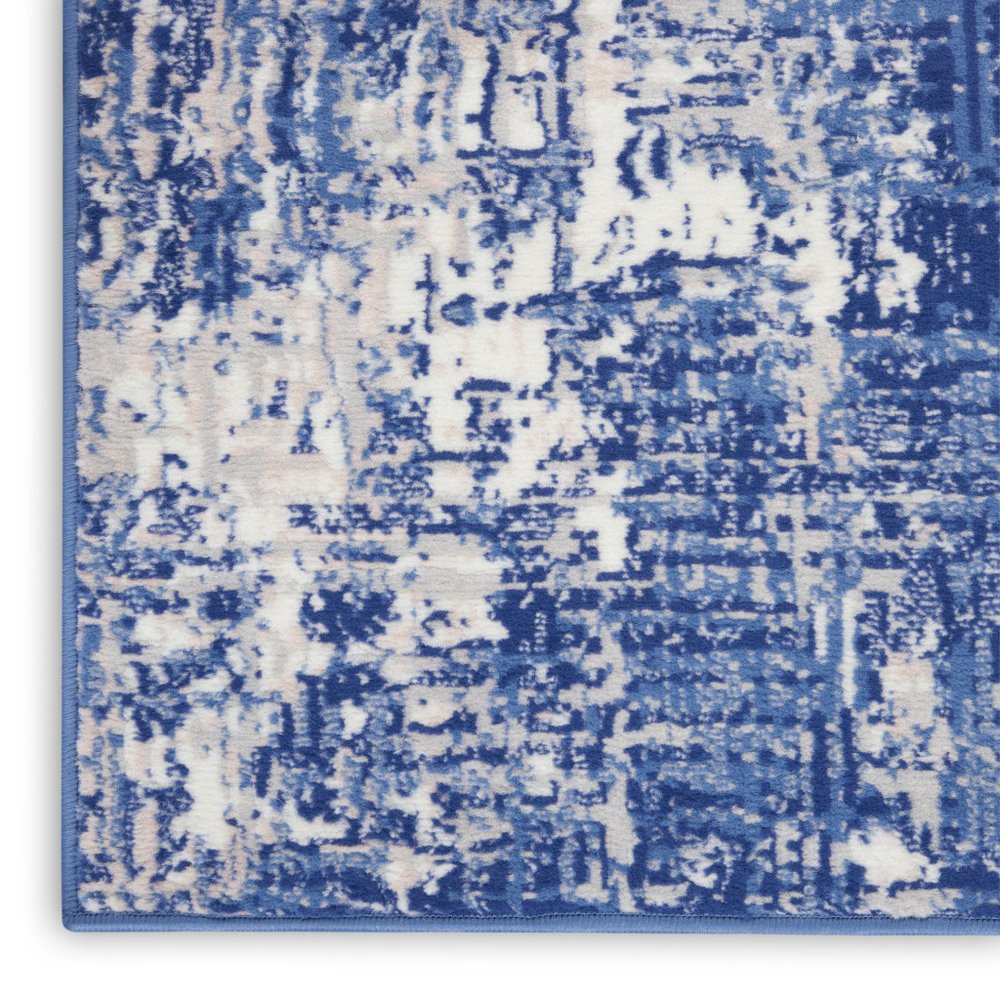 6' X 9' Blue And Ivory Abstract Distressed Area Rug