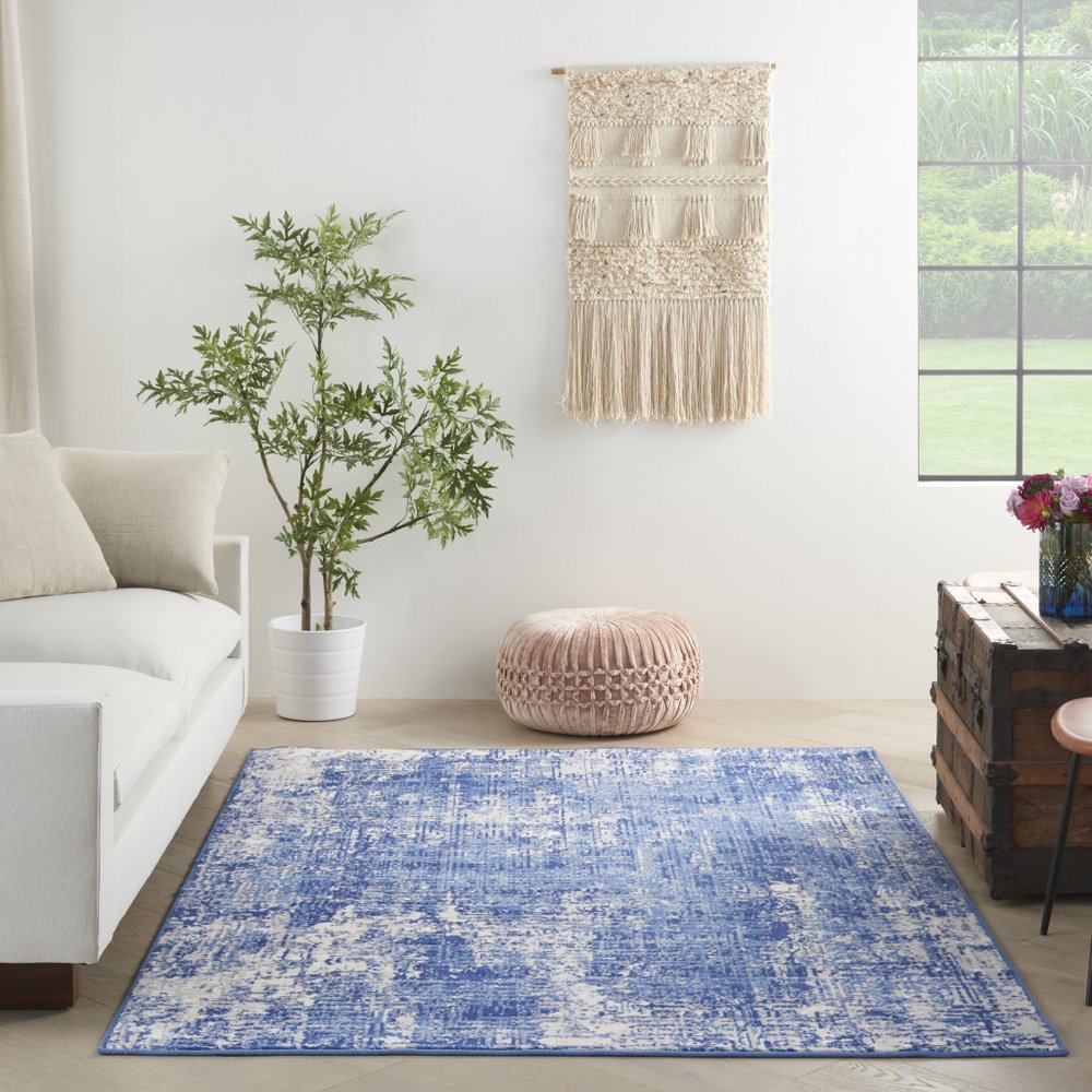 6' X 9' Blue And Ivory Abstract Distressed Area Rug