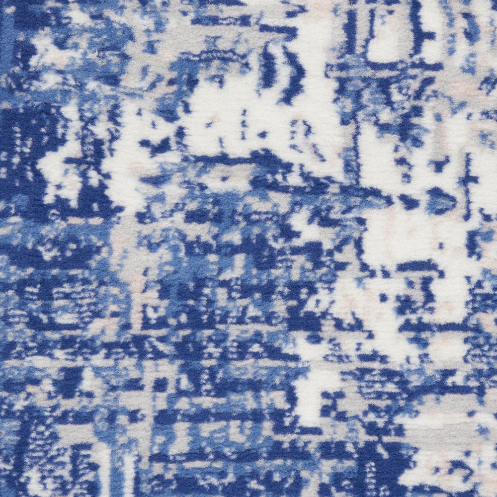 6' X 9' Blue And Ivory Abstract Distressed Area Rug