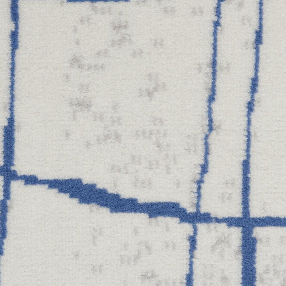 6' X 9' Ivory And Blue Geometric Distressed Area Rug