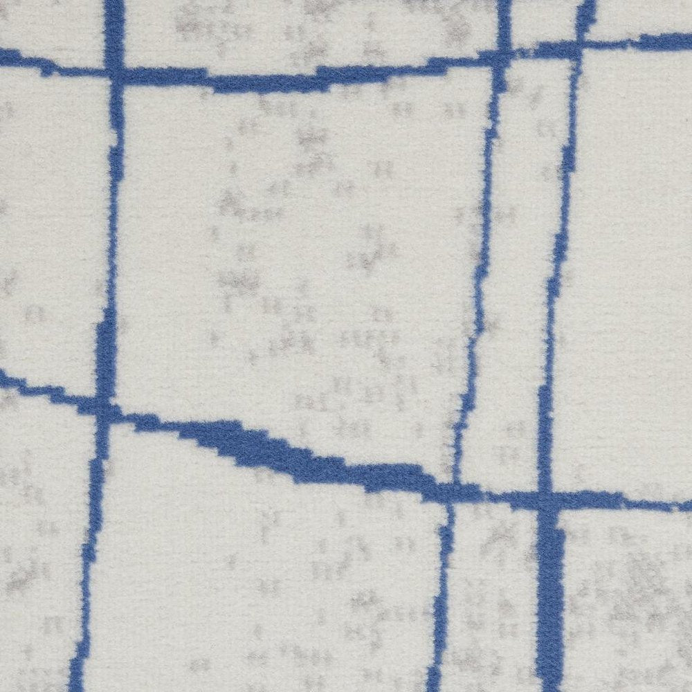 6' X 9' Ivory And Blue Geometric Distressed Area Rug