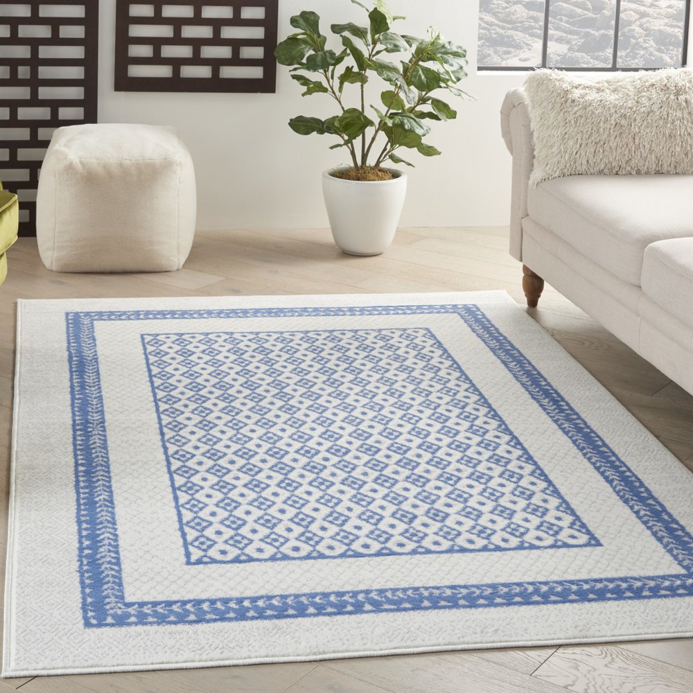 5' X 7' Ivory And Blue Geometric Area Rug