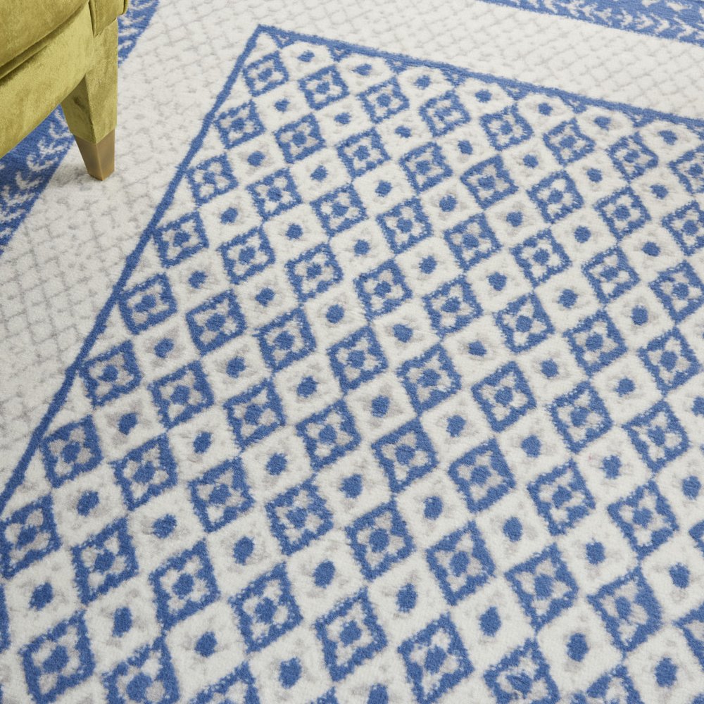 5' X 7' Ivory And Blue Geometric Area Rug