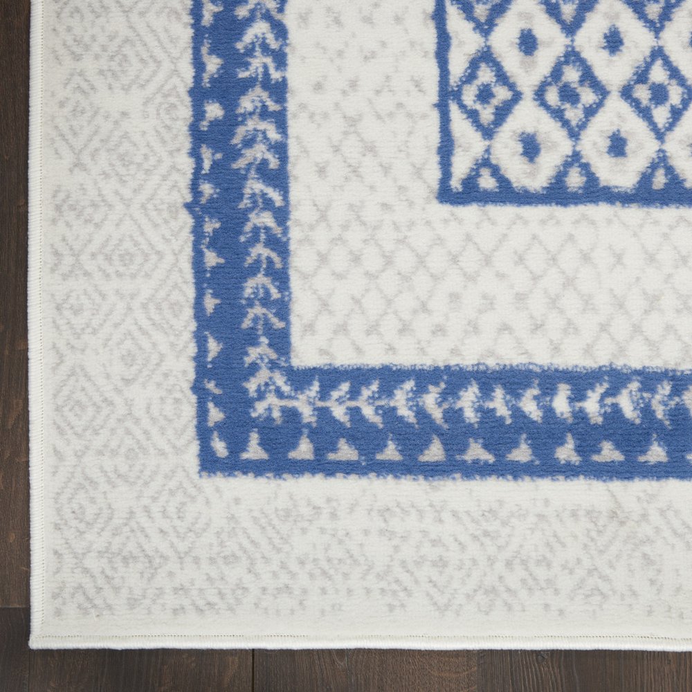 5' X 7' Ivory And Blue Geometric Area Rug