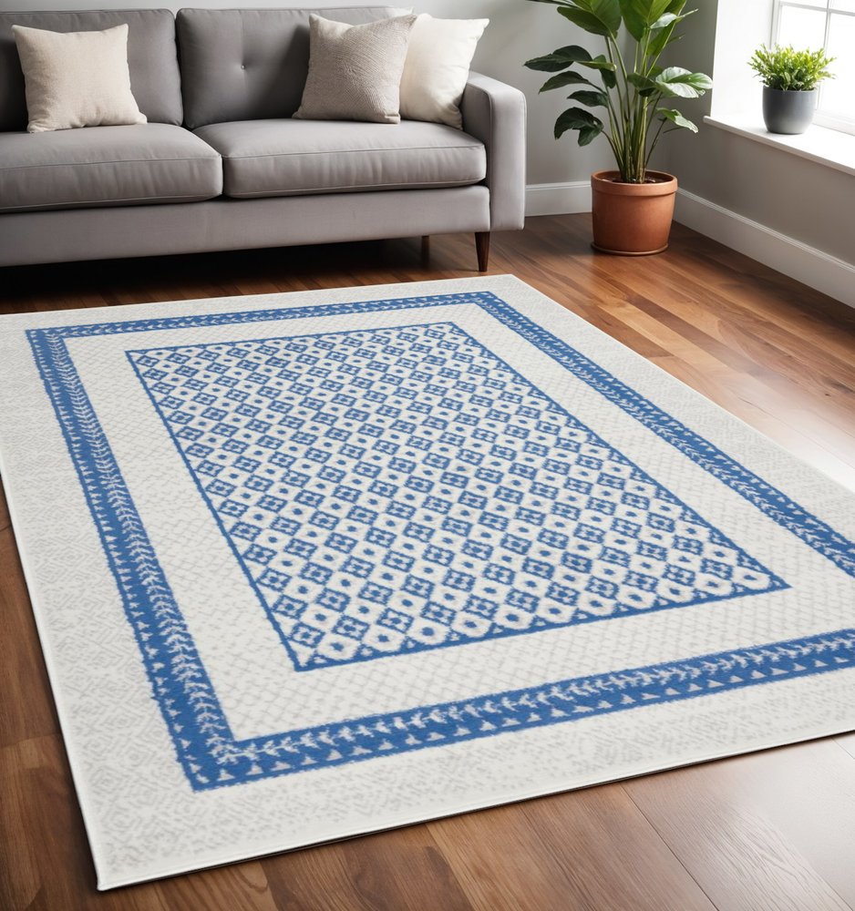 5' X 7' Ivory And Blue Geometric Area Rug