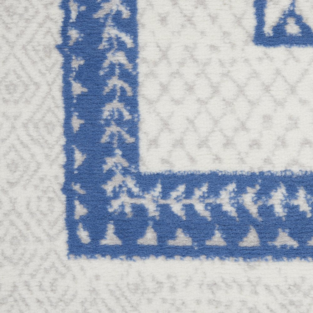 5' X 7' Ivory And Blue Geometric Area Rug