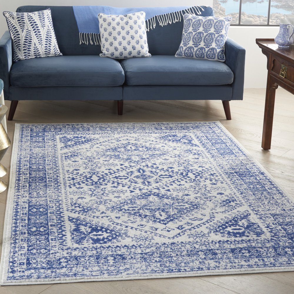 6' X 9' Ivory And Blue Geometric Distressed Area Rug