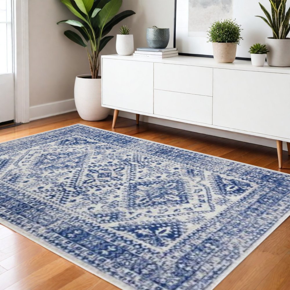 6' X 9' Ivory And Blue Geometric Distressed Area Rug
