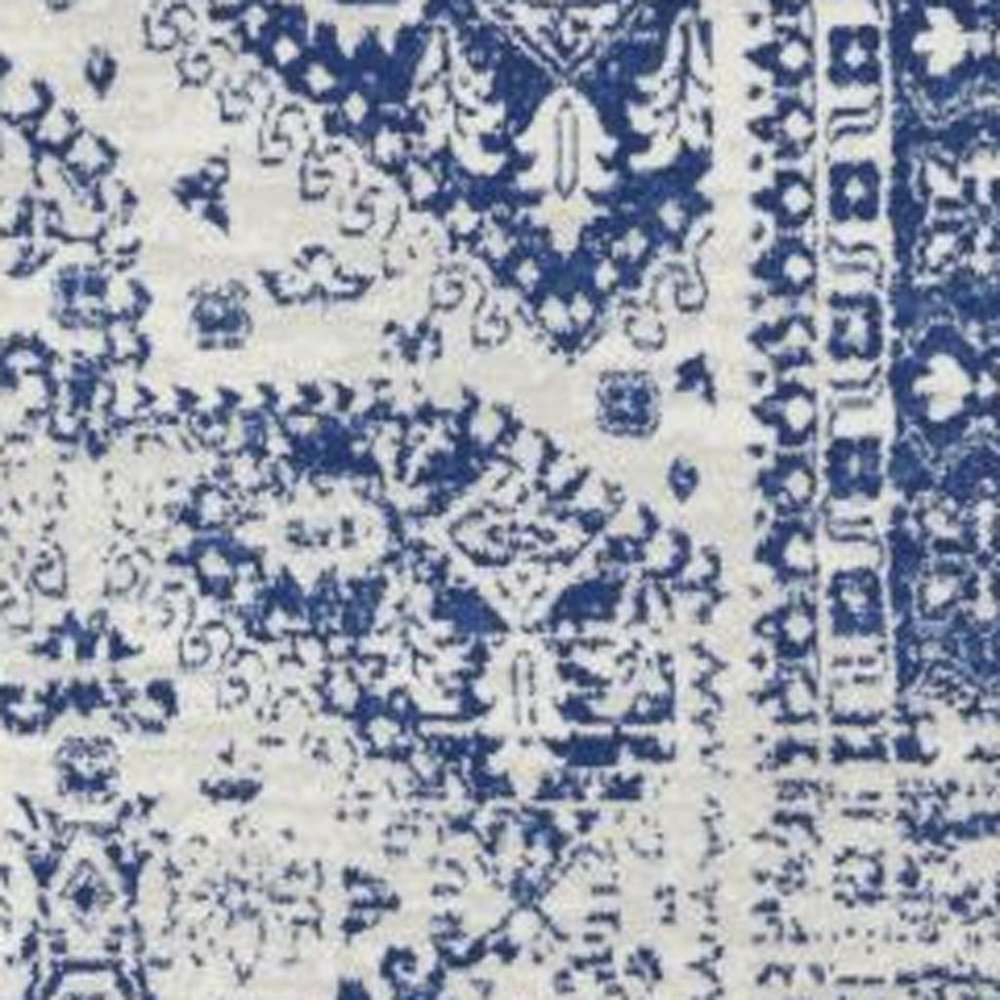6' X 9' Ivory And Blue Geometric Distressed Area Rug