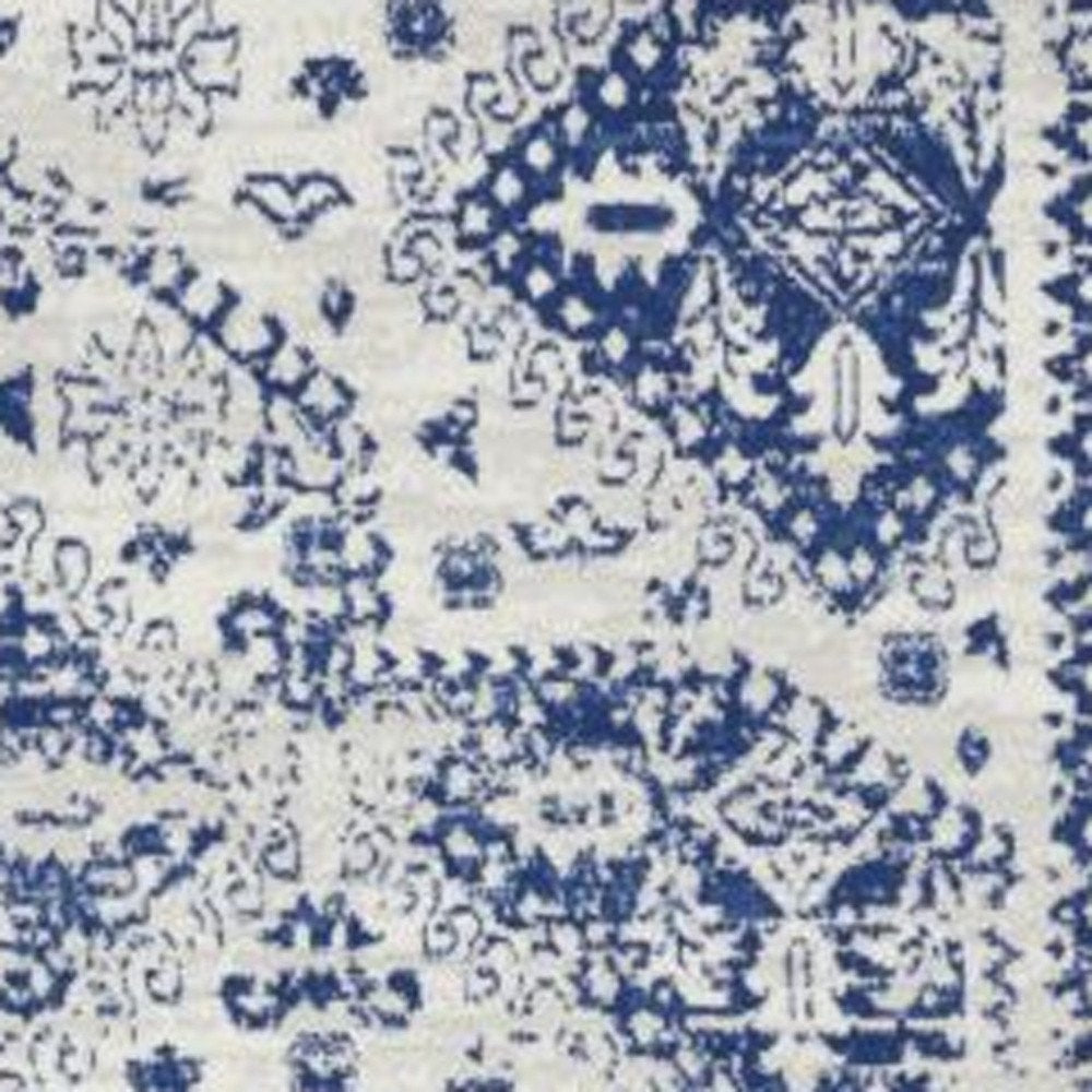 6' X 9' Ivory And Blue Geometric Distressed Area Rug