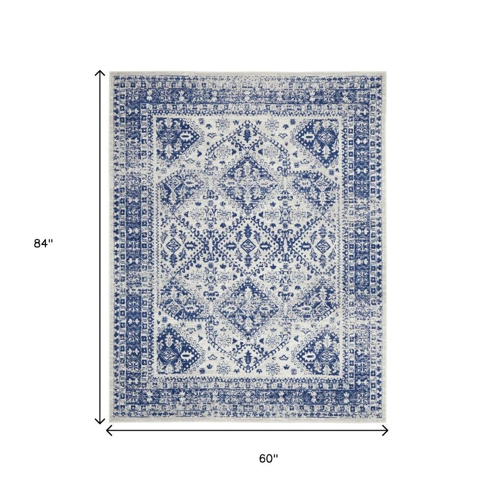 6' X 9' Ivory And Blue Geometric Distressed Area Rug