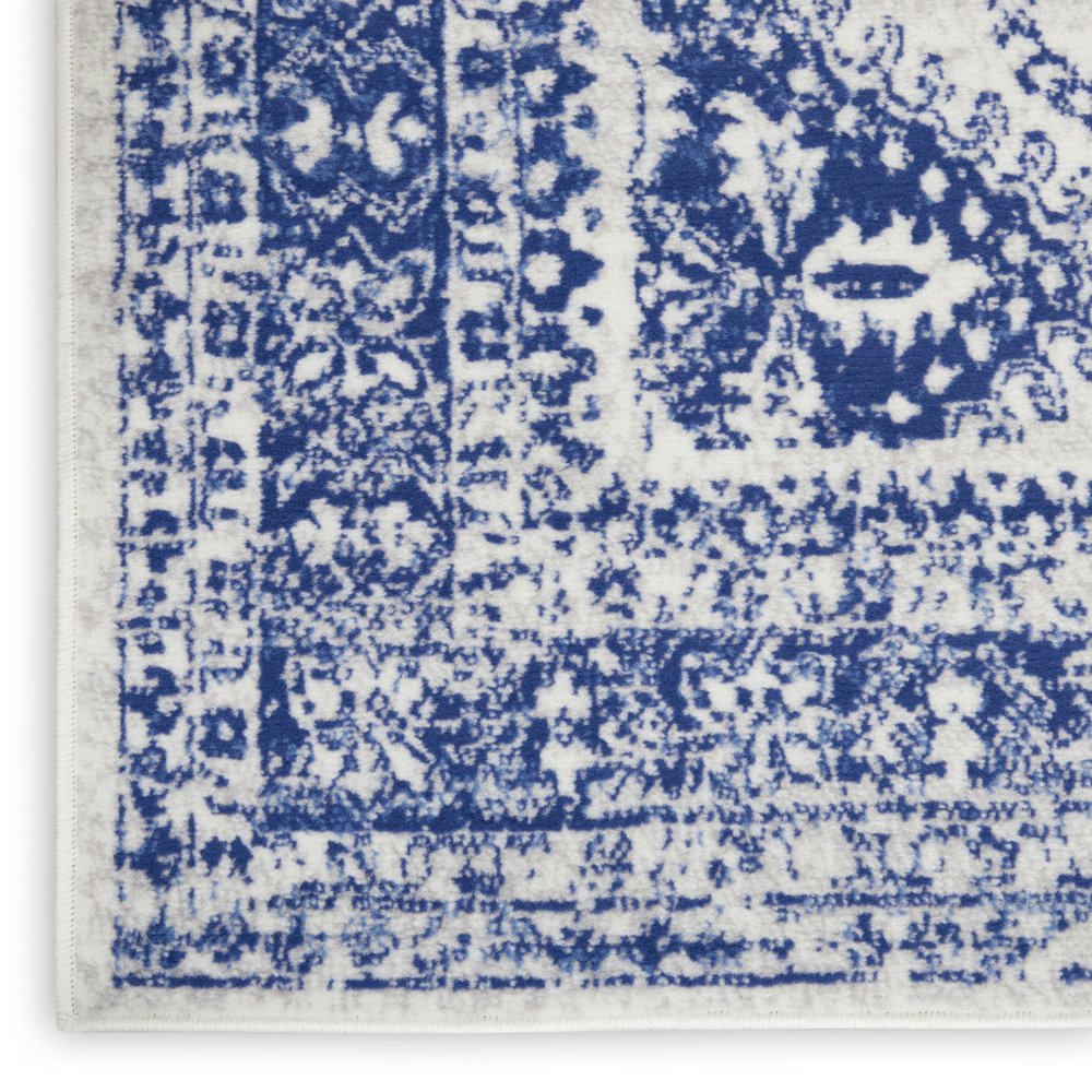 6' X 9' Ivory And Blue Geometric Distressed Area Rug