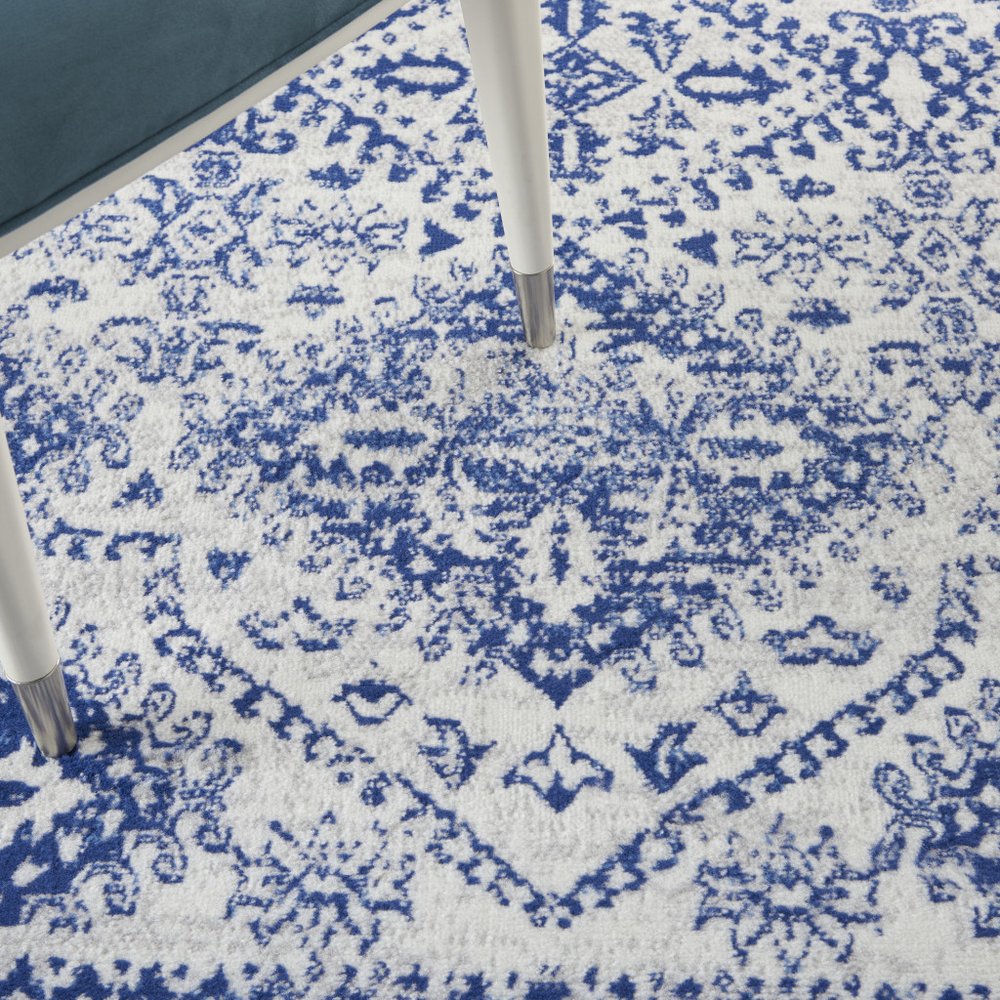 6' X 9' Ivory And Blue Geometric Distressed Area Rug