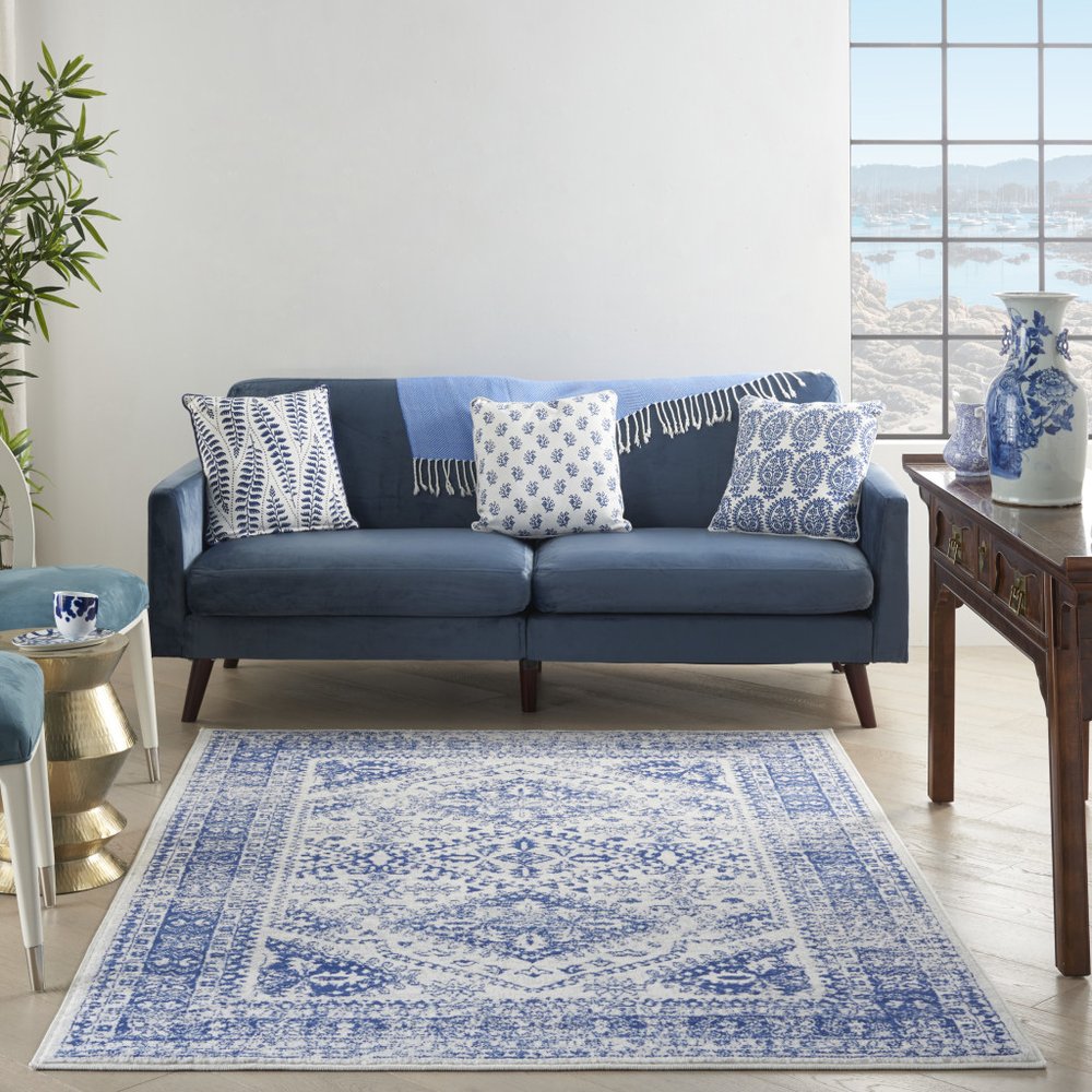 6' X 9' Ivory And Blue Geometric Distressed Area Rug