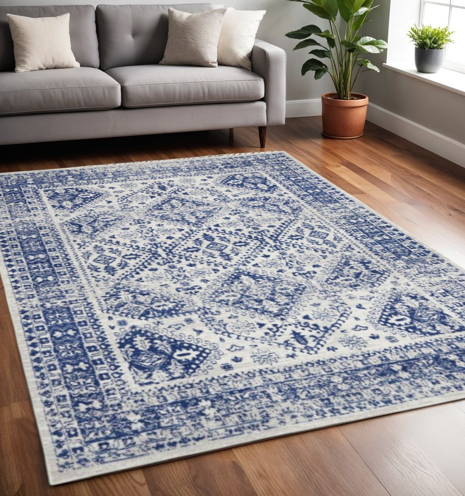6' X 9' Ivory And Blue Geometric Distressed Area Rug