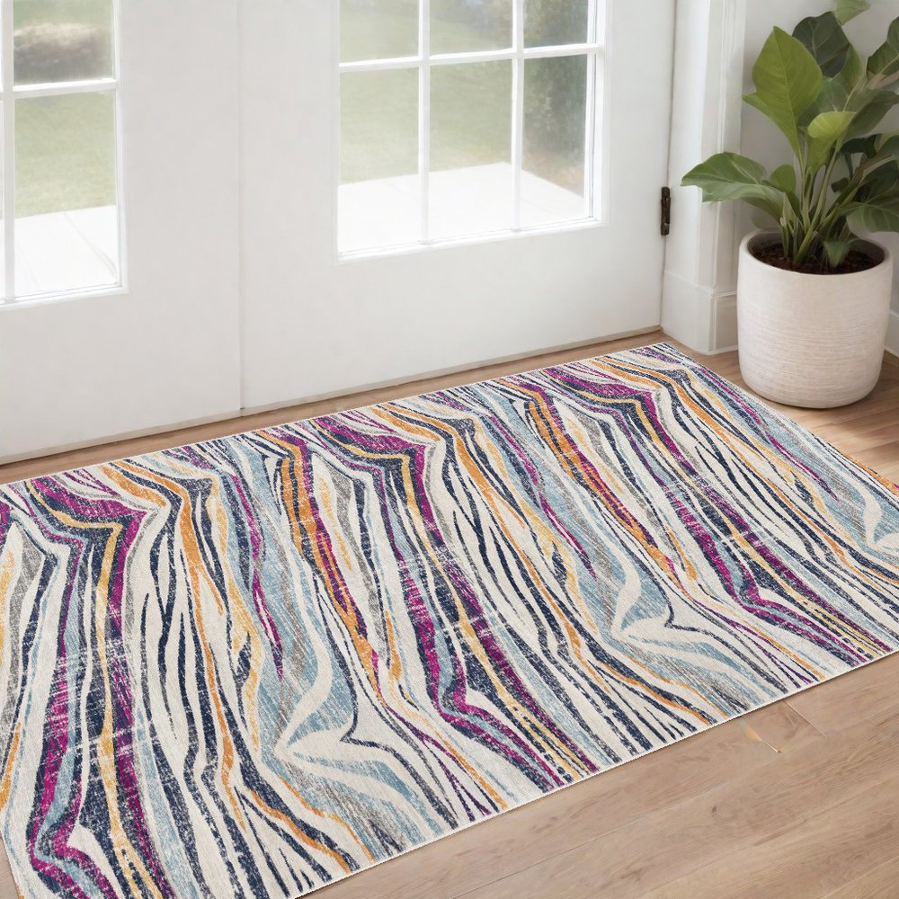 2' X 4' Blue and Gold Abstract Area Rug
