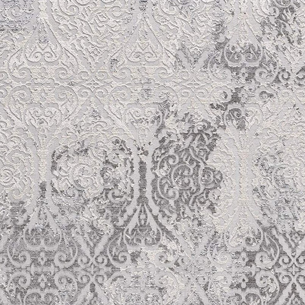 7' X 10' Cream And Gray Tinted Ogee Pattern Area Rug