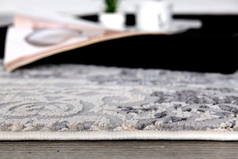 7' X 10' Cream And Gray Tinted Ogee Pattern Area Rug