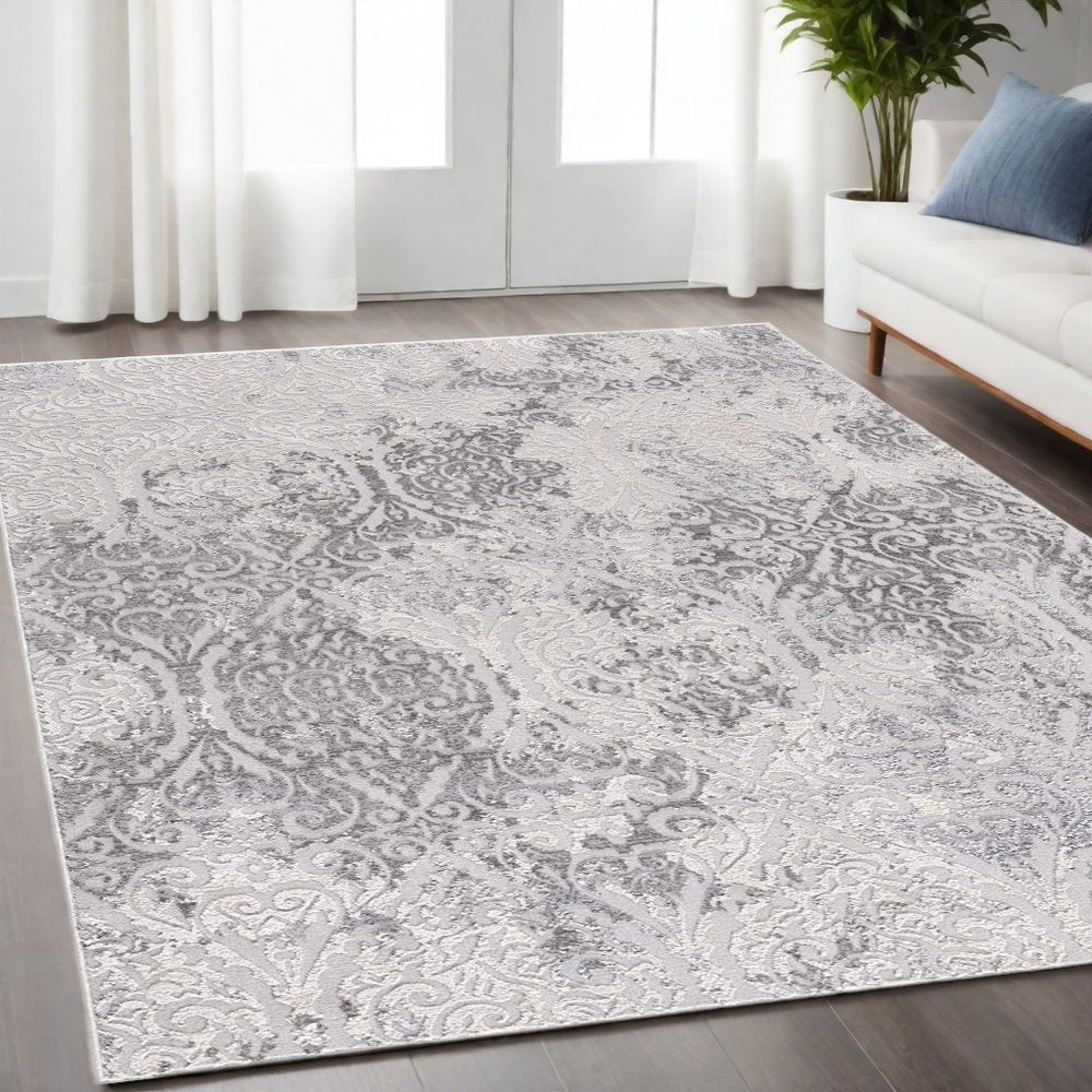 7' X 10' Cream And Gray Tinted Ogee Pattern Area Rug