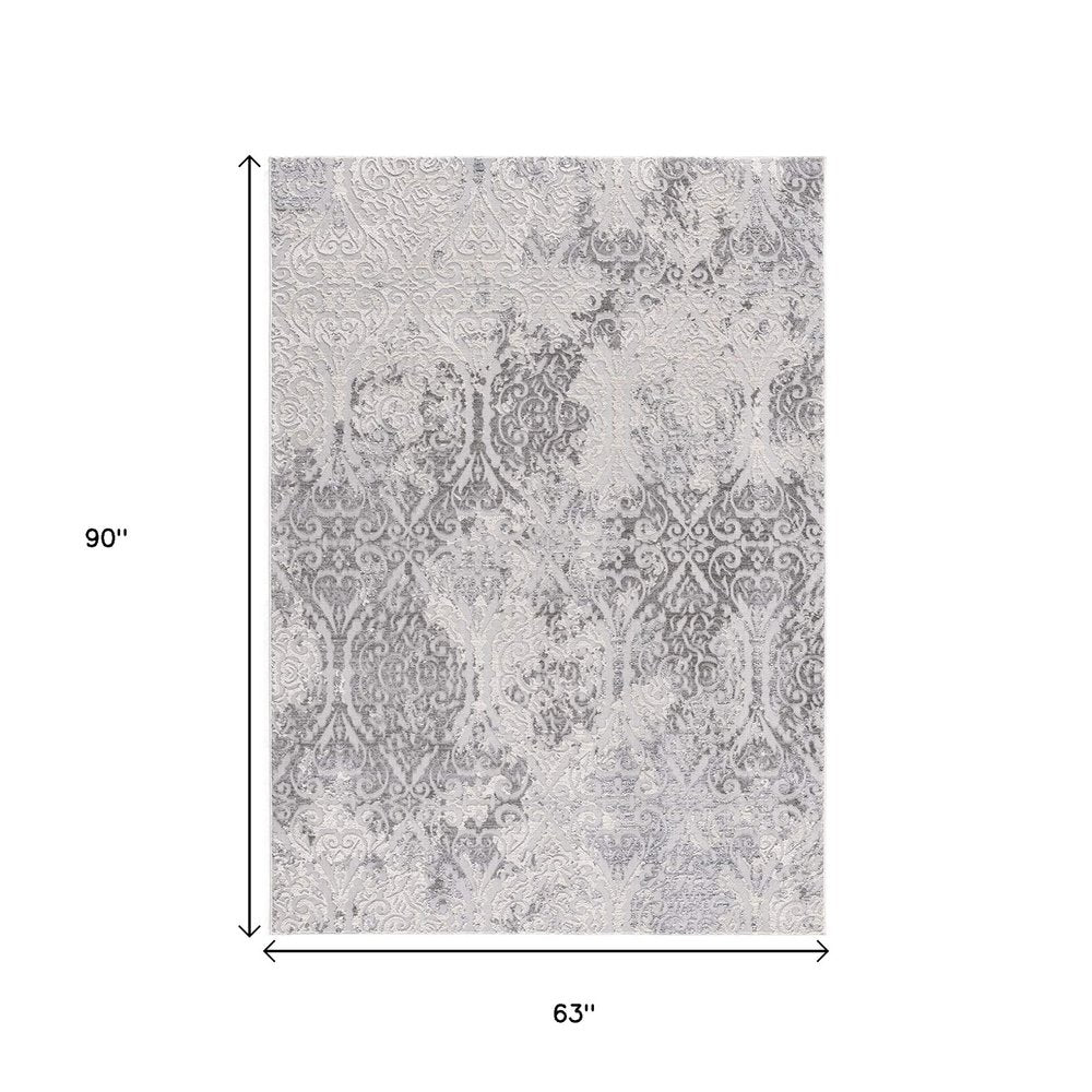 7' X 10' Cream And Gray Tinted Ogee Pattern Area Rug