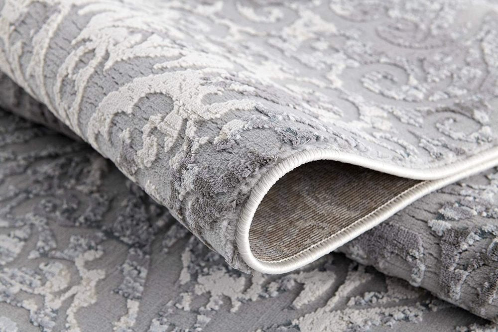 7' X 10' Cream And Gray Tinted Ogee Pattern Area Rug