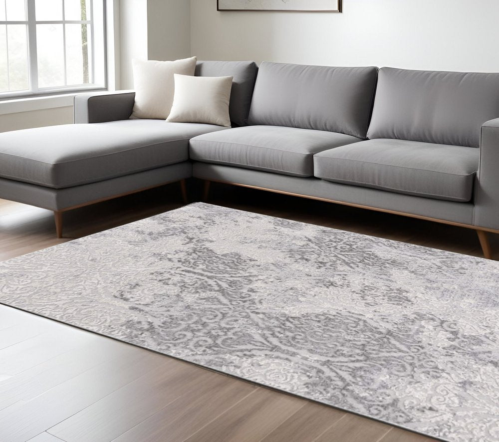 7' X 10' Cream And Gray Tinted Ogee Pattern Area Rug