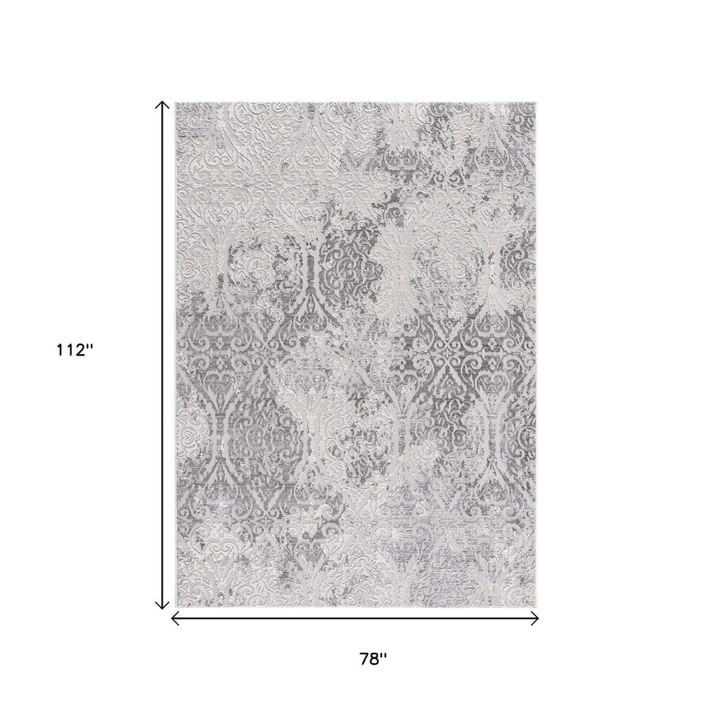 7' X 10' Cream And Gray Tinted Ogee Pattern Area Rug