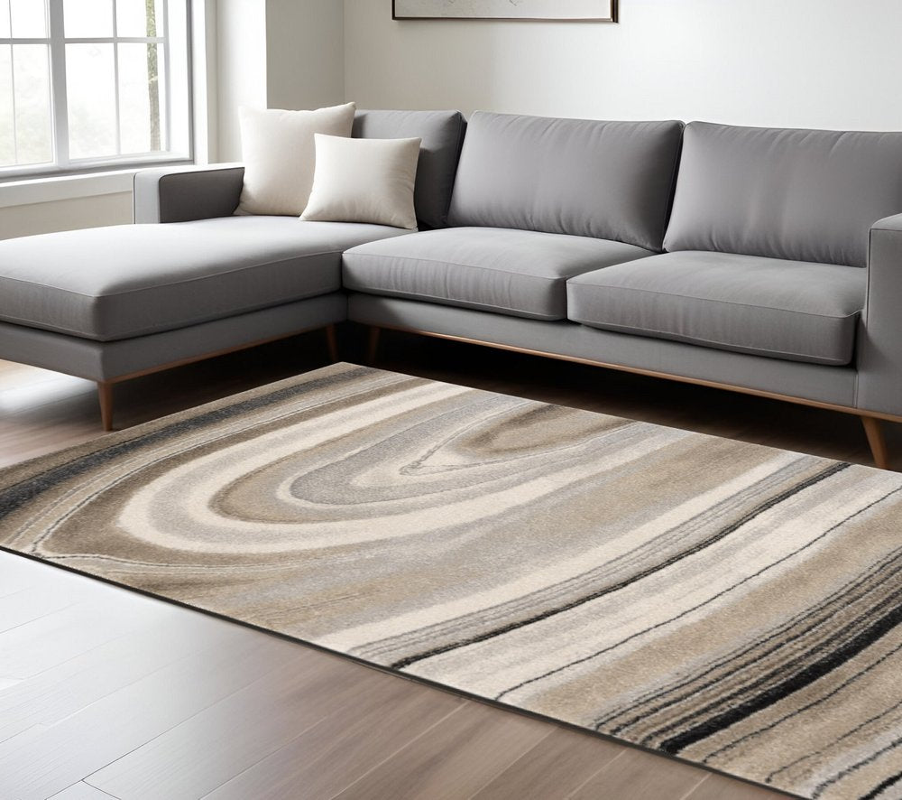 5' X 8' Cream and Tan Abstract Marble Area Rug