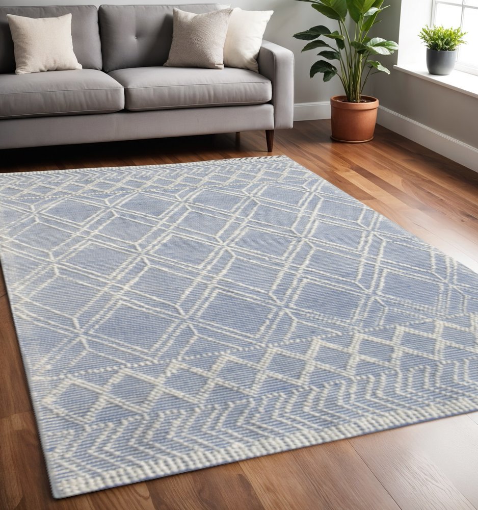 5' X 7' Blue and Ivory Geometric Handmade Area Rug