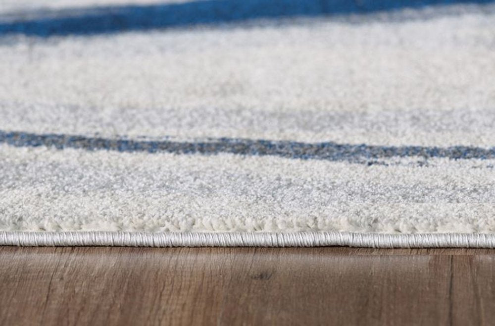 5' X 8' Ivory and Blue Abstract Area Rug