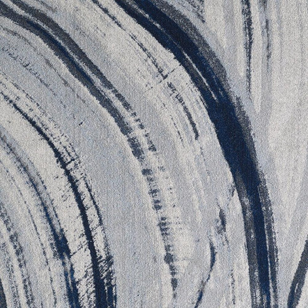 7' X 10' Ivory and Blue Abstract Area Rug