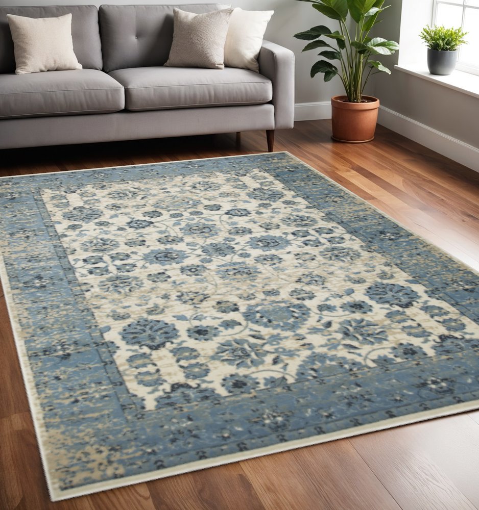 5' X 8' Ivory And Sky Blue Oriental Area Rug
