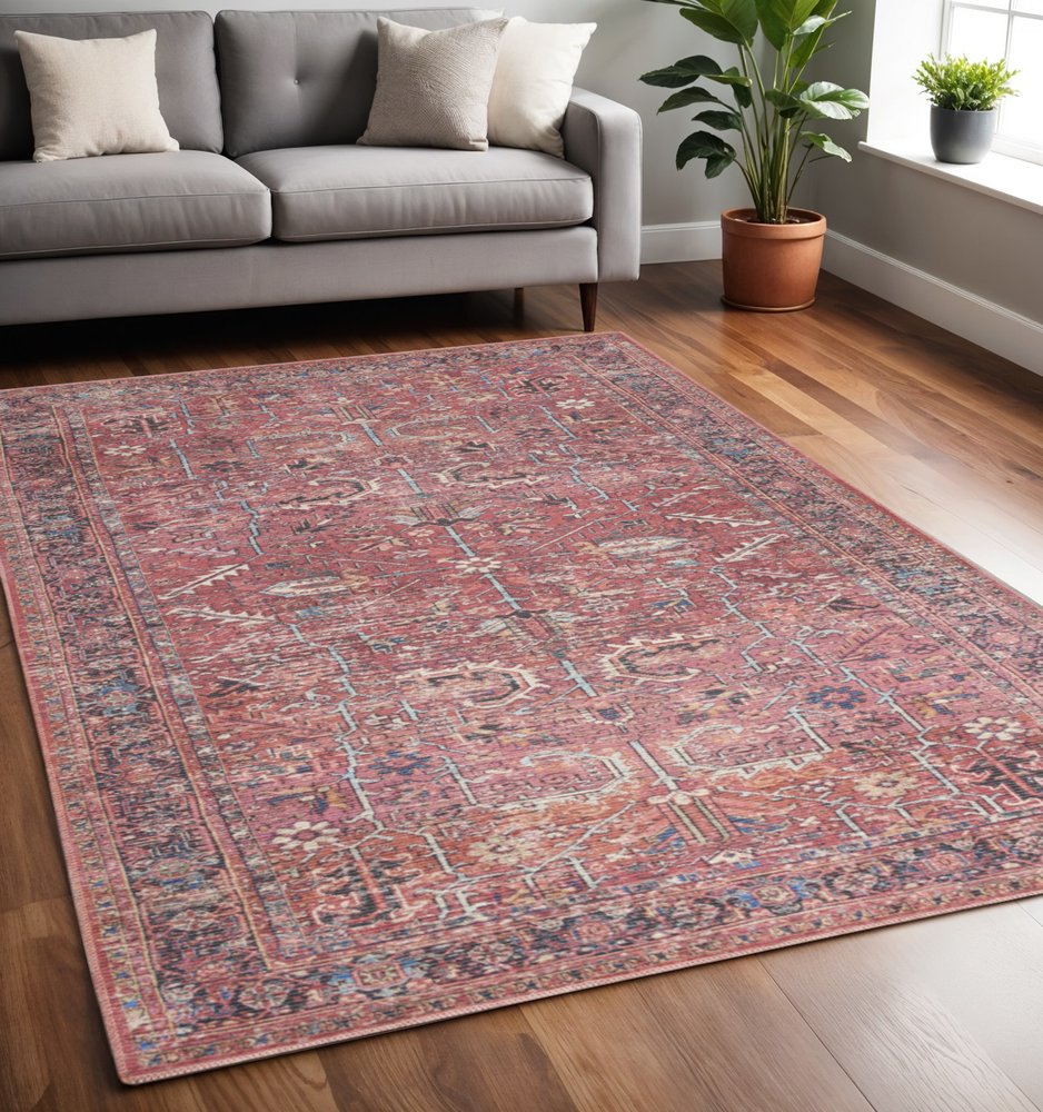 5' X 7' Pink And Blue Oriental Distressed Washable Area Rug