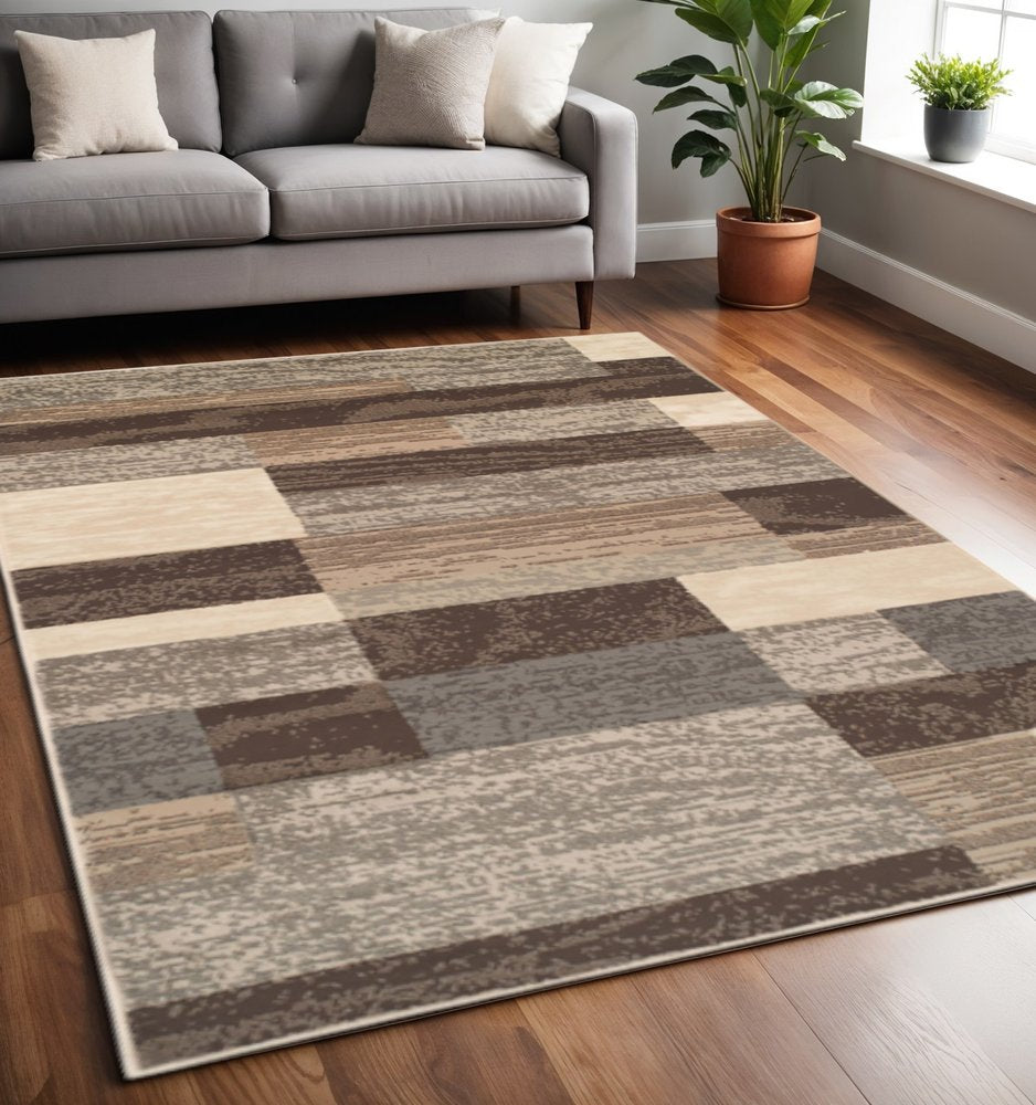 5' X 8' Beige Slate Gray And Brown Patchwork Area Rug