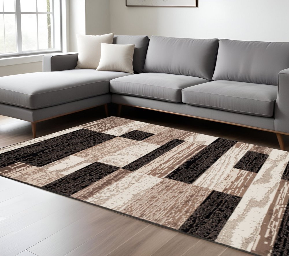 6' X 9' Black Brown And Beige Patchwork Area Rug