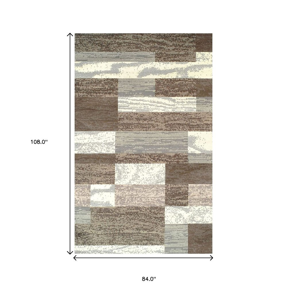 7' X 9' Blue And Ivory Patchwork Area Rug