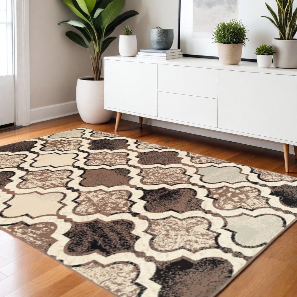 5' X 8' Ivory Brown And Black Quatrefoil Distressed Area Rug