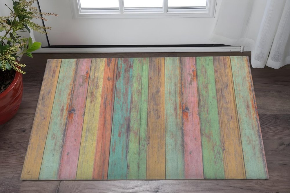 2' X 4' Distressed Aqua Green And Pink Printed Vinyl Area Rug With UV Protection