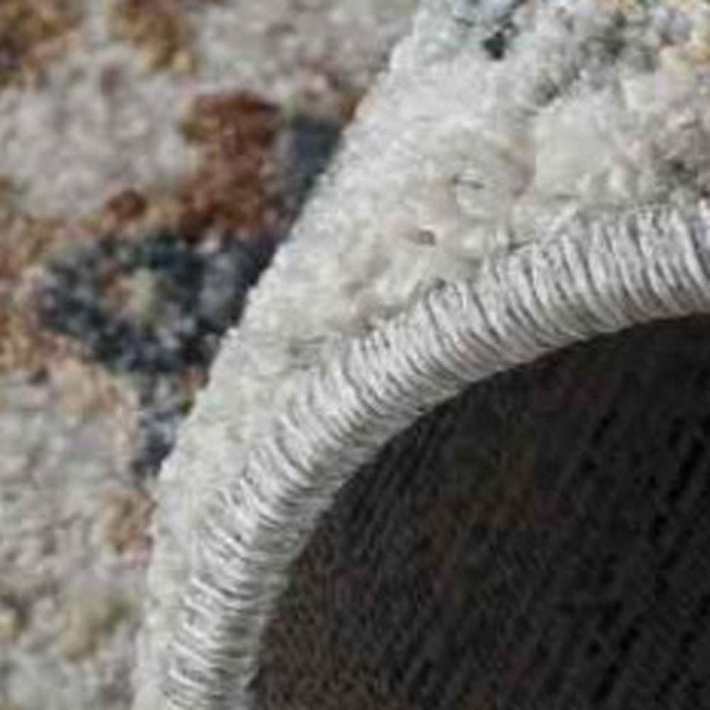 5' X 8' Beige and Blue Abstract Power Loom Area Rug